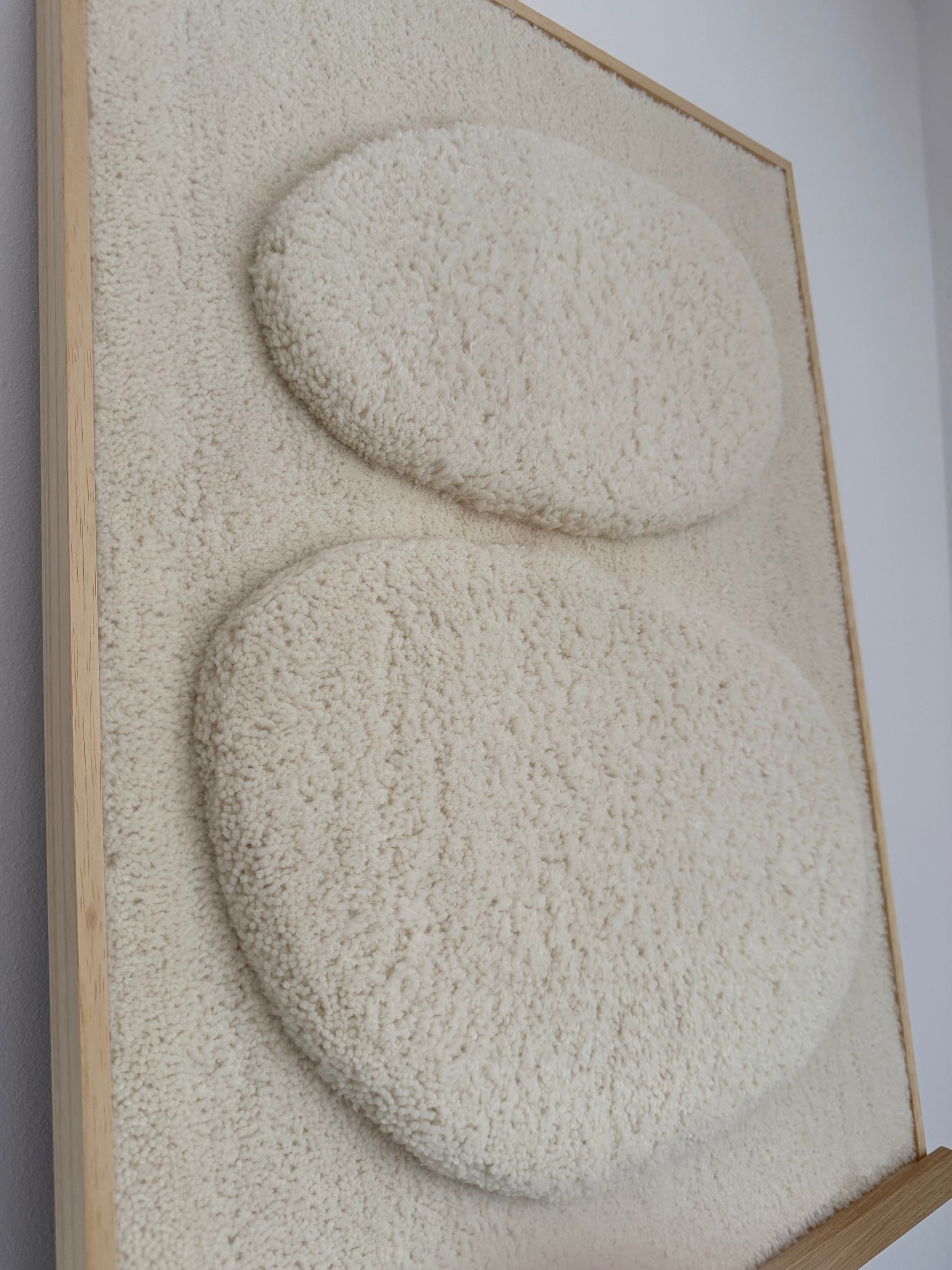 Close-up of cut pile texture on handmade textile wall art